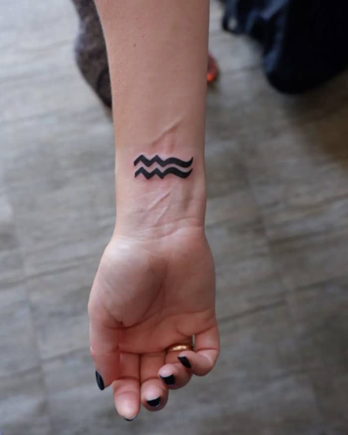 Aquarius Tattoos - minimalist aquarius symbol