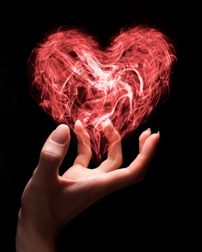 Love Spells - hand holding heart