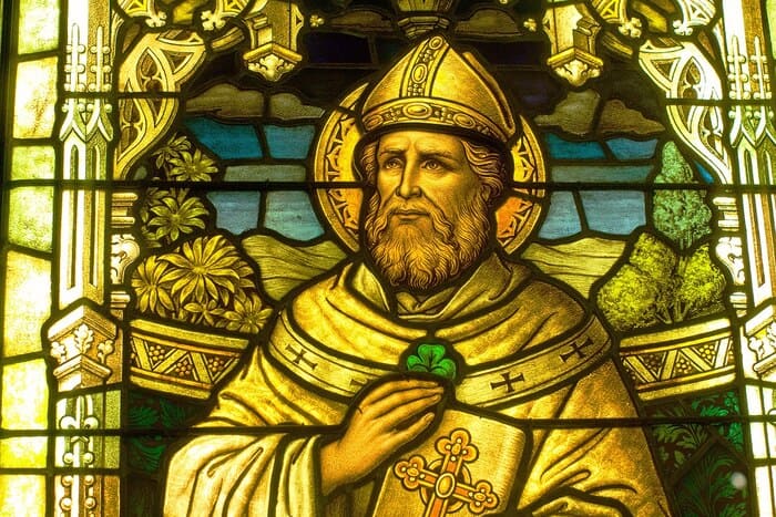 St Patrick and the Snakes Pagans - Stained Glass Portrait of St. Patrick holding shamrock