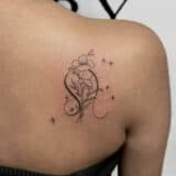 Leo Tattoos - floral leo glyph shoulder